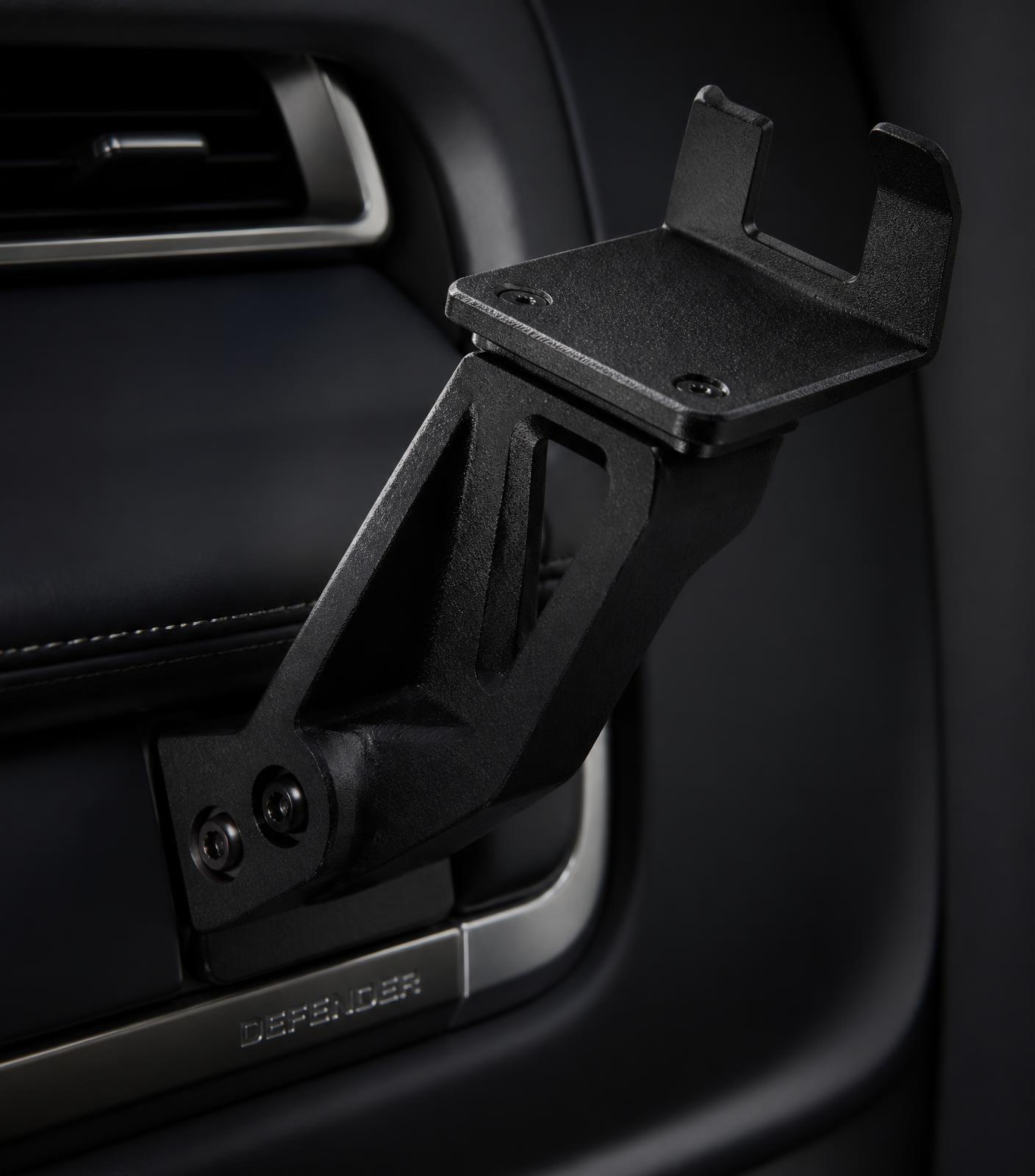 Precision printed bracket installed in a vehicle interior